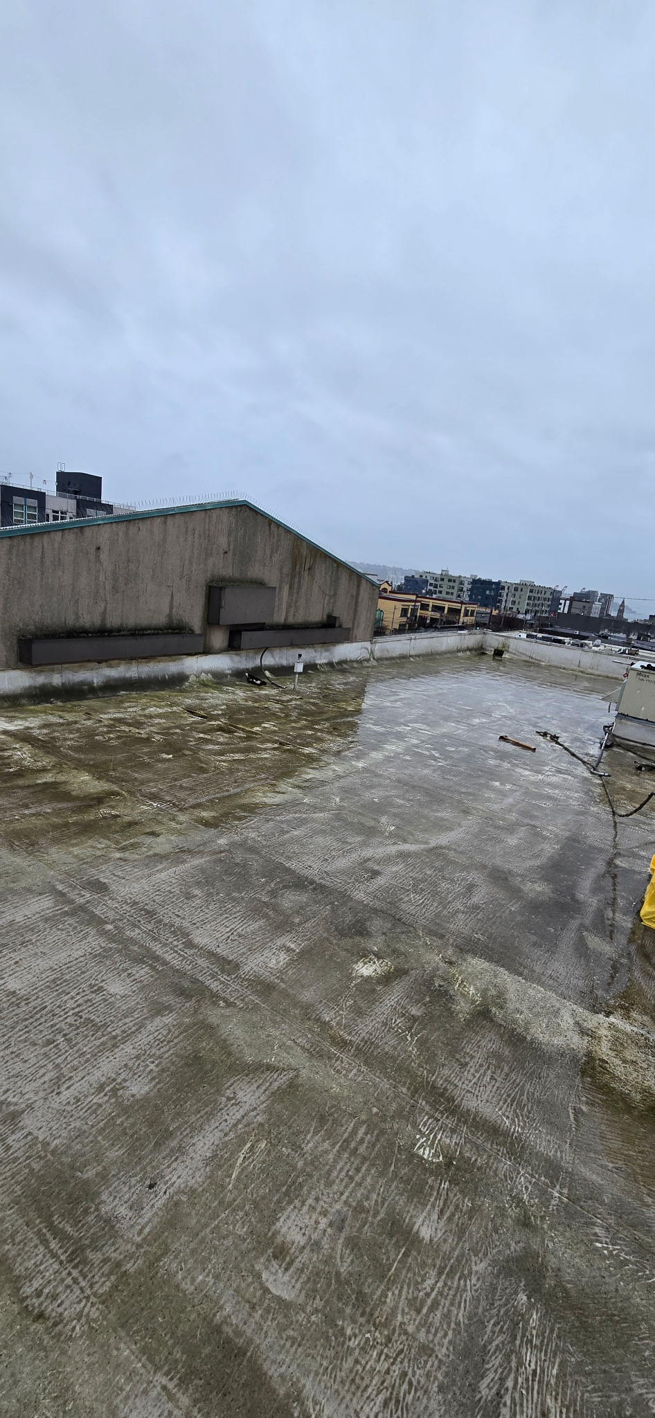 Flat commercial rooftop representing Tacoma service area